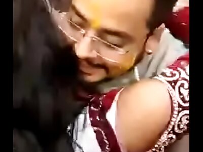 Super-cute Indian bride kissing publicly